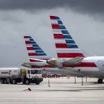 Tails fins of passenger aircraft operated by American Airlines at Miami International Airport in Miami on June 16. (Eva Marie Uzcategui/Bloomberg)