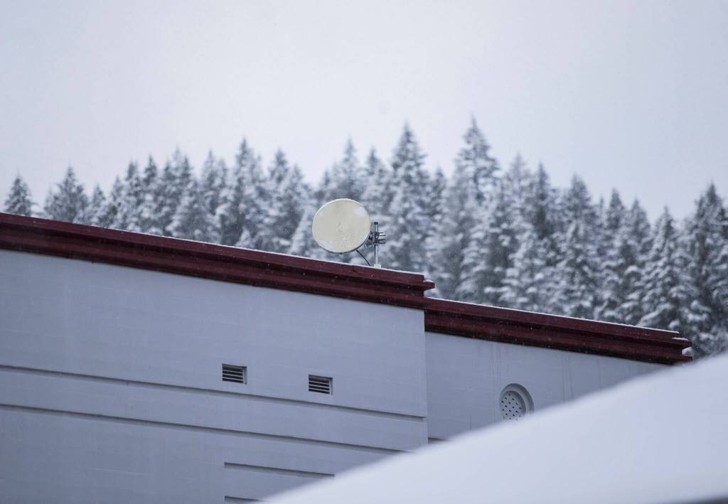 A radio dish points toward a tower that delivers the schools internet connection in Skykomish. (Olivia Vanni / The Herald)
