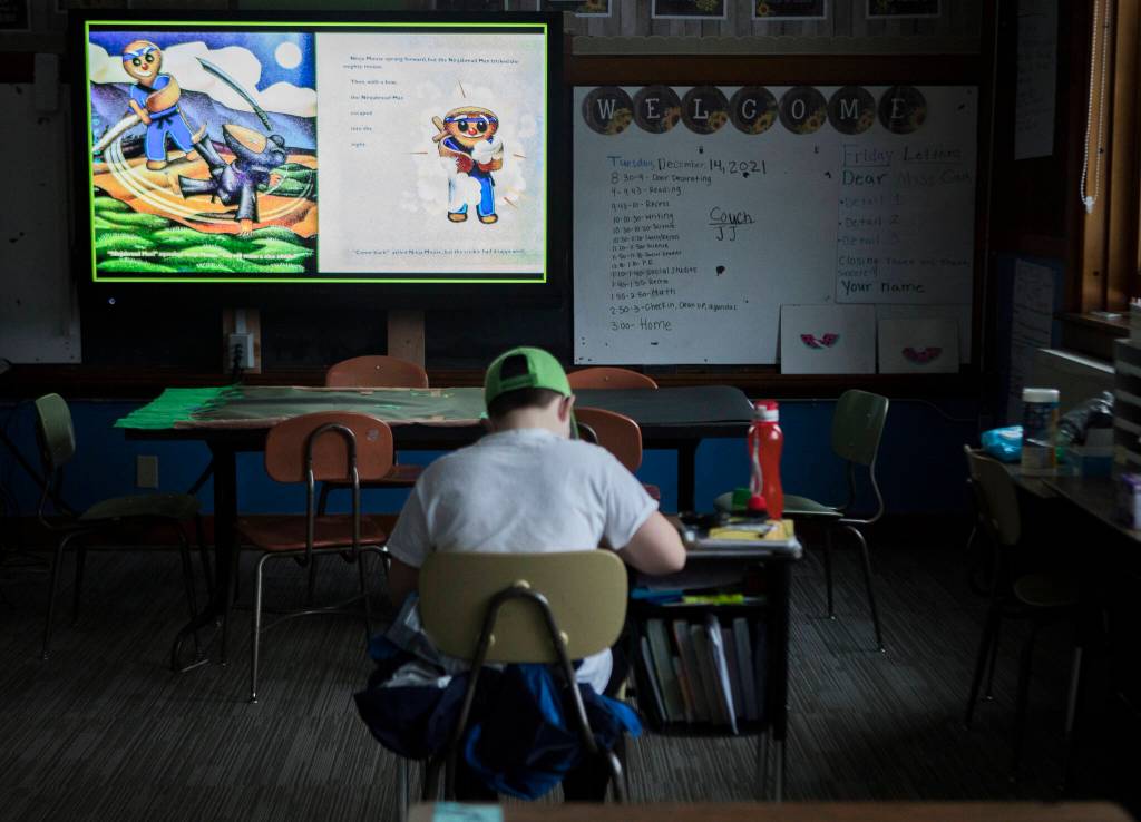 School work is projected on a smart board in a classroom at the school in Skykomish. (Olivia Vanni / The Herald)