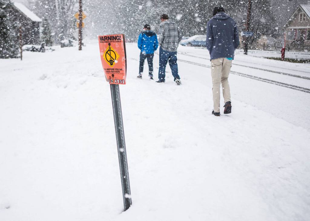 A small sign marks the location of an untapped fiber-optic cable that runs through Skykomish. (Olivia Vanni / The Herald)