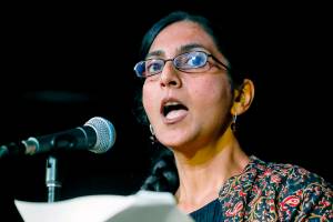Seattle Councilmember Kshama Sawant speaks to supporters Tuesday, Dec. 7, 2021, in Seattle. Preliminary results show voters in Seattle narrowly in favor of recalling Sawant.  (Jennifer Buchanan/The Seattle Times via AP)