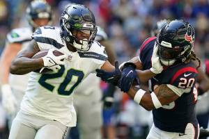 Seattle Seahawks running back Rashaad Penny (20) carries the ball during an NFL football game against the Houston Texans, Sunday, Dec. 12, 2021, in Houston. (AP Photo/Matt Patterson)