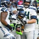 Seattle Seahawks wide receiver Tyler Lockett (16) celebrates with teammates after catching a two-point conversion against the Houston Texans during the second half of a game Sunday in Houston. (AP Photo/Justin Rex )
