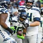Seattle Seahawks wide receiver Tyler Lockett (16) celebrates with teammates after catching a pall for a two-point conversion against the Houston Texans during the second half of an NFL football game, Sunday, Dec. 12, 2021, in Houston. (AP Photo/Justin Rex )