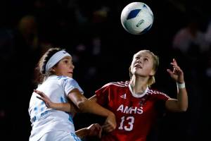Hockinson's Abby Dombrow, left, and Archbishop Murphy's Reeve Borseth vie for control Saturday evening during the 2A state championship at Shoreline Stadium on November 20, 2021. The Wildcats won 2-0. (Kevin Clark / The Herald)