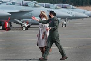 First lady Jill Biden, left, is given a tour of a Growler aircraft by Naval Aviator Lt. Cate Oakley, Tuesday, March 9, 2021, at Naval Air Station Whidbey Island in Oak Harbor, Wash. (Ken Lambert /The Seattle Times via AP, Pool)