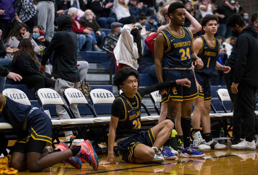 The Shorecrest bench reacts to a missed shot in the final seconds of regular time to send the game against Arlington to overtime on Tuesday, Dec. 14, 2021 in Arlington, Wa. (Olivia Vanni / The Herald)