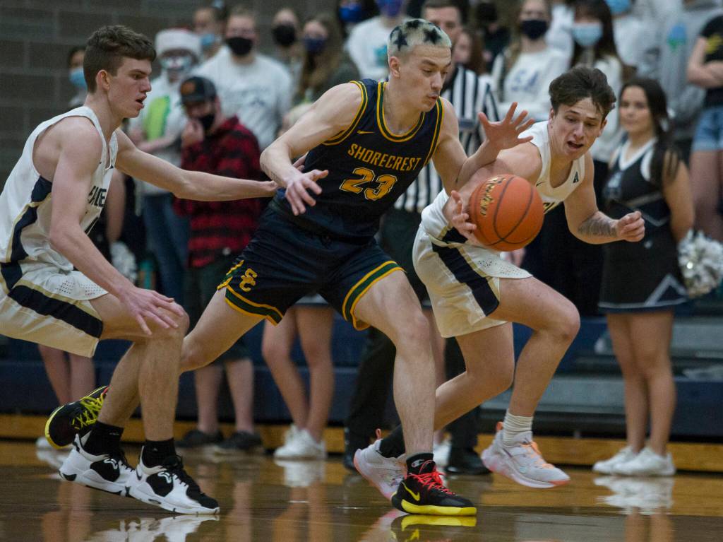 Arlingtons Grayson Falk steals the ball from Shorecrests Parker Baumann during the game on Tuesday, Dec. 14, 2021 in Arlington, Wa. (Olivia Vanni / The Herald)