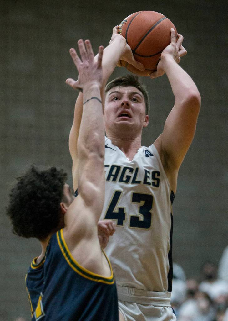 Arlingtons Ethan Martin attempts a jump shot during the game against Shorecrest on Tuesday, Dec. 14, 2021 in Arlington, Wa. (Olivia Vanni / The Herald)
