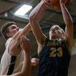 Shorecrests Parker Baumann has his shot blocked during the game against Arlington on Tuesday, Dec. 14, 2021 in Arlington, Wa. (Olivia Vanni / The Herald)