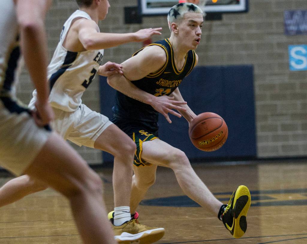 Shorecrests Parker Baumann drives to the hoop during the game against Arlington on Tuesday, Dec. 14, 2021 in Arlington, Wa. (Olivia Vanni / The Herald)