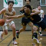 Shorecrests Elijah Johnson tries to steal the ball from Arlingtons Grayson Falk during the game on Tuesday in Arlington. (Olivia Vanni / The Herald)
