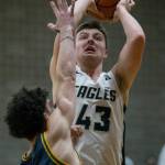 Arlingtons Ethan Martin attempts a jump shot during the game against Shorecrest on Tuesday in Arlington. (Olivia Vanni / The Herald)