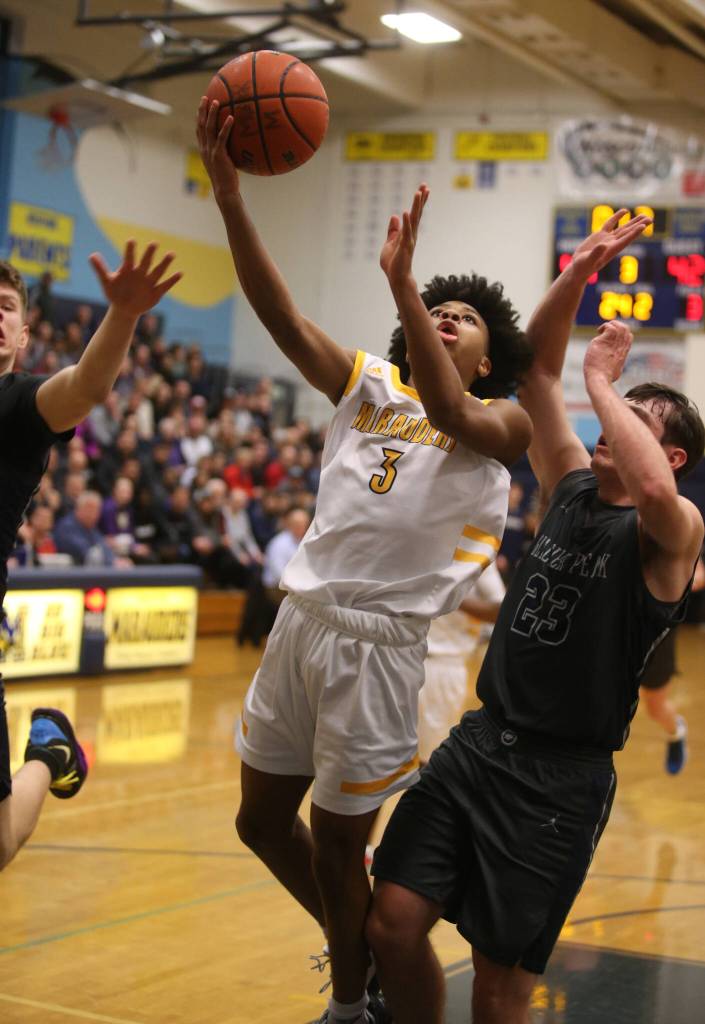 Mariners Jailin Johnson scores on a layup as Mariner lost to Glacier Peak 90-87 in double overtime on Feb. 11, 2020, in Everett. (Andy Bronson / Herald file)