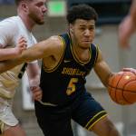 Shorecrest's Elijah Johnson drives to the hoop during the game against Arlington on Tuesday, Dec. 14, 2021 in Arlington, Wa. (Olivia Vanni / The Herald)