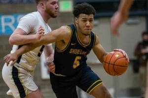 Shorecrest's Elijah Johnson drives to the hoop during the game against Arlington on Tuesday, Dec. 14, 2021 in Arlington, Wa. (Olivia Vanni / The Herald)