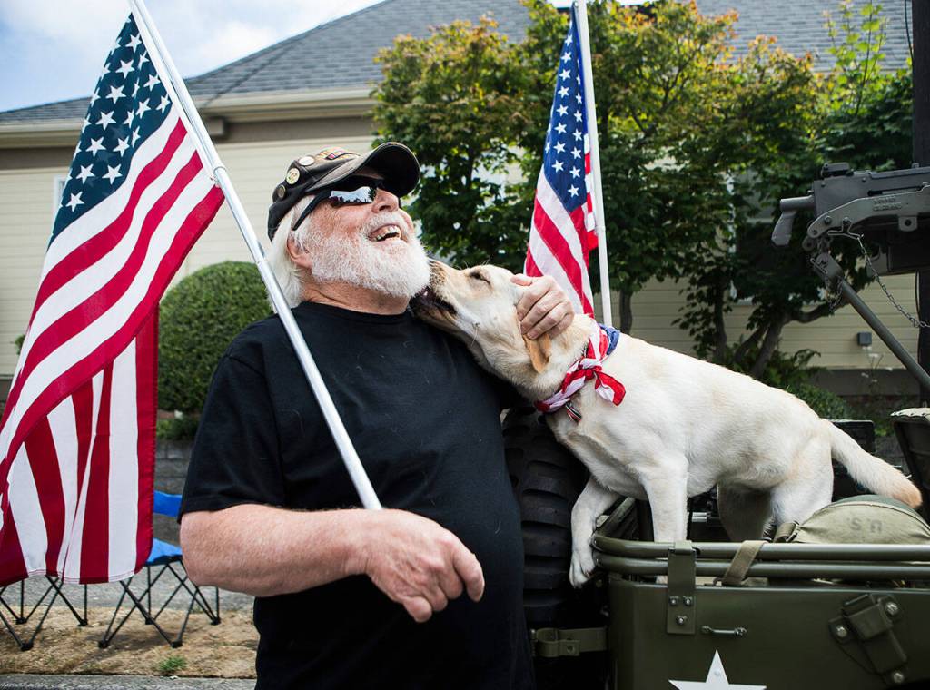 Bob Little, a Vietnam War veteran, waits to walk in the Edmonds Kind of 4th parade on July 4. (Olivia Vanni / The Herald)