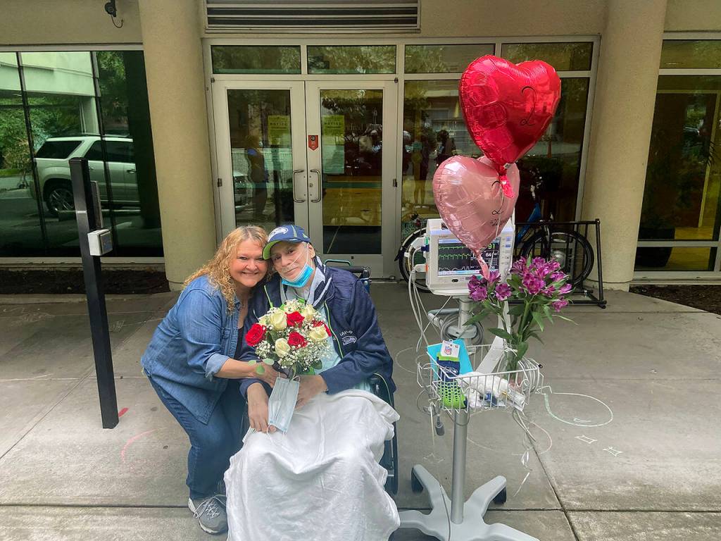 Gunard Hulskamp and his wife, Cheryl Hulskamp, outside of Kindred Hospital in Seattle, where they briefly celebrated their 22nd anniversary on Oct. 16, 2021. (Submitted photo)