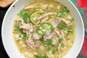 Hot and nourishing, this easy chicken pozole is made with jarred salsa verde. (Gretchen McKay/Pittsburgh Post-Gazette/TNS)
