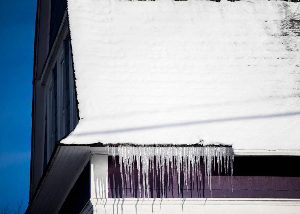 Icicles hang from the gutter of a home along Grand Avenue on Monday in Everett. (Olivia Vanni / The Herald)