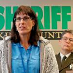 In this 2019 photo, King County Detective Kathleen Decker speaks at a news conference, while Sheriff Mitzi G. Johanknecht looks on, at right, in Seattle. Decker, a now-retired 33-year veteran of the King County Sheriff's Office, made several false statements under oath when she obtained a search warrant in a murder case in 2019, resulting in a man’s false arrest on drug charges, newly unsealed federal court orders show. (Greg Gilbert/The Seattle Times via AP)