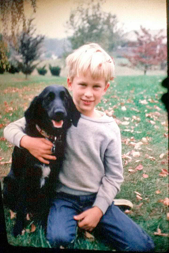 Greg Stewart as a boy with his familys dog, Mitsi. (Courtesy of the Stewart family)