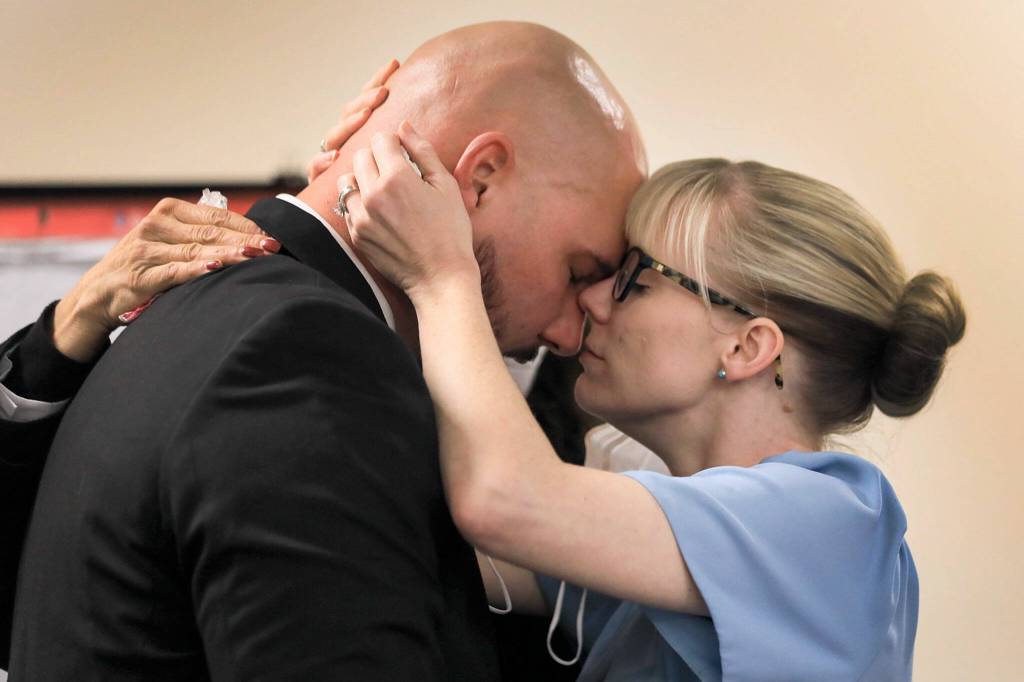 Ryan Leenders (left) and Amber Leenders take comfort after hearing the not guilty verdicts handed down by a jury Thursday afternoon at the Snohomish County Superior Courthouse in Everett. (Kevin Clark / The Herald)