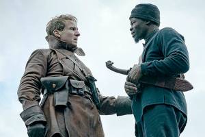 Ralph Fiennes, left, and Djimon Hounsou in "The King’s Man." (Peter Mountain/Twentieth Century Fox/TNS)