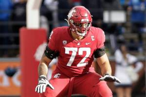 Washington State offensive lineman Abraham Lucas prepares to block during the second half of an NCAA college football game against BYU, Saturday, Oct. 23, 2021, in Pullman, Wash. (AP Photo/Young Kwak)