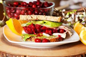 Cutline: Holiday feasts make delicious leftover meals, like this turkey and cranberry sandwich.
