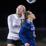 Jacksons Kate Russell jumps to head the ball during a game at Glacier Peak High School on Oct. 26, 2021 in Snohomish. (Olivia Vanni / The Herald)