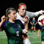 Snohomishs Sara Rodgers (right) chase down a throw in during a game at Edmonds-Woodway High School in Edmonds on Oct. 7, 2021. (Kevin Clark / The Herald)