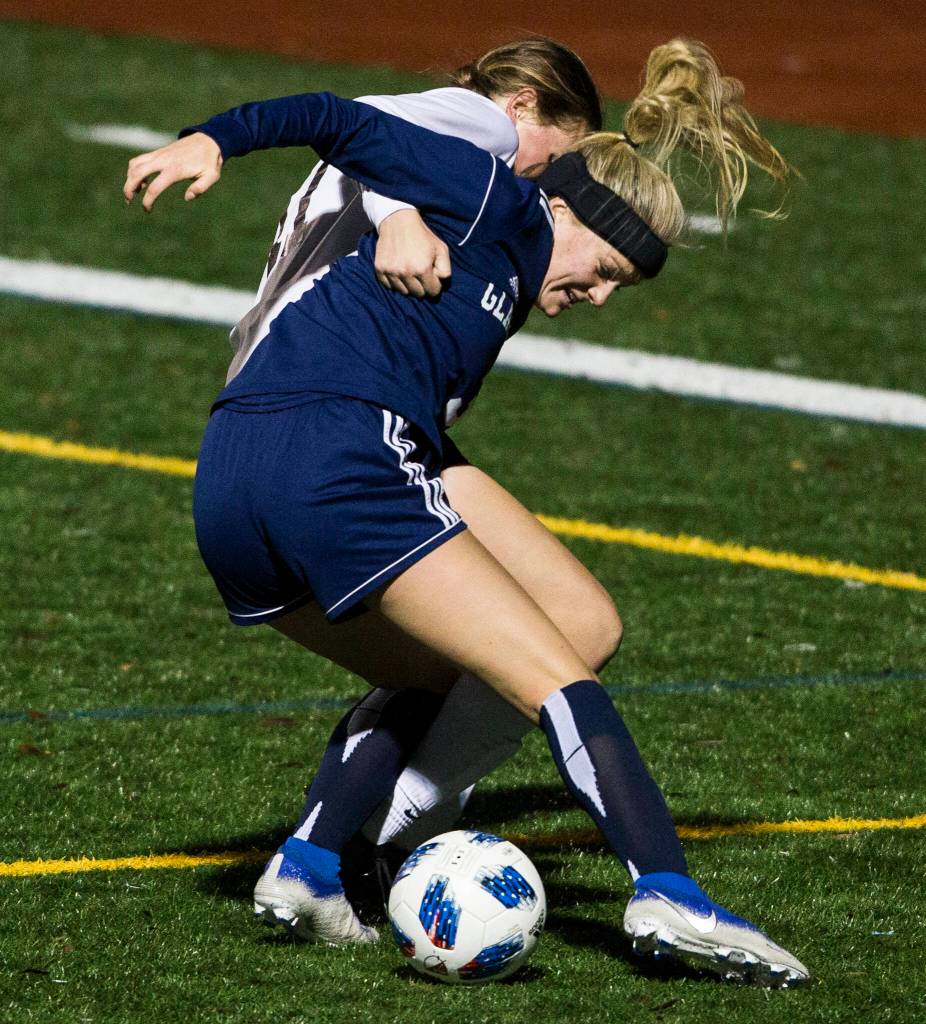 Glacier Peaks Chloe Seelhoff fights for the ball during a game against Jackson on Oct. 26, 2021 in Snohomish. (Olivia Vanni / The Herald)