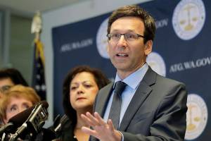 FILE - In this Aug. 26, 2019, file photo, Washington Attorney General Bob Ferguson speaks at a news conference in Seattle. Washington state sued Johnson & Johnson on Thursday, Jan. 2, 2020, claiming the company was negligent when it used deceptive marketing to say the drugs were effective for treating pain and were unlikely to cause addiction. The lawsuit filed Thursday says the company that supplies raw materials used to make opiates drove the pharmaceutical industry to recklessly expand the production of the drugs. (AP Photo/Ted S. Warren, File)