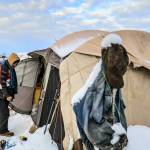Richard Williams enters the tent he shares with his brother Wednesday afternoon in Arlington on December 29, 2021.  (Kevin Clark / The Herald)