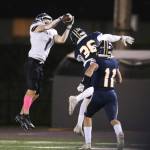 Kamiak's Wesley Garrett (1) grabs a pass and runs in for a touchdown Kamiak beat Mariner 41-14  in a football game at Goddard Stadium on Tuesday, Oct. 19, 2021 in Everett, Washington.  (Andy Bronson / The Herald)