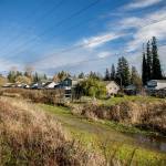 Houses along 88th Drive SE visible from the utility access road slated to become the Powerline Trail on Thursday, Jan. 13, 2022 in Lake Stevens, Washington. (Olivia Vanni / The Herald)