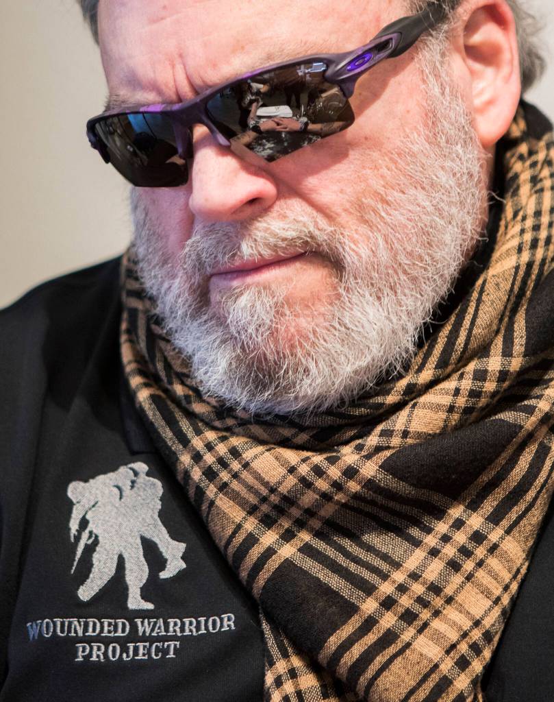 Keith Reyes watches as salon owner Laura Finsen works on his feet during his pedicure at Nail Flare in Stanwood. (Olivia Vanni / The Herald)