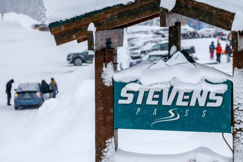 A sign welcomes skiers to Stevens Pass. (Kevin Clark / The Herald)