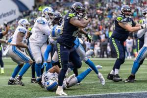 Seattle Seahawks running back Rashaad Penny scores a touchdown during the first half of an NFL football game, Sunday, Jan. 2, 2022, in Seattle. (AP Photo/Stephen Brashear)