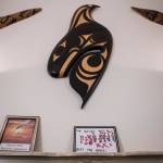 Art is displayed over the mantle in one of the gathering rooms at the Healing Lodge in Stanwood. (Olivia Vanni / The Herald)
