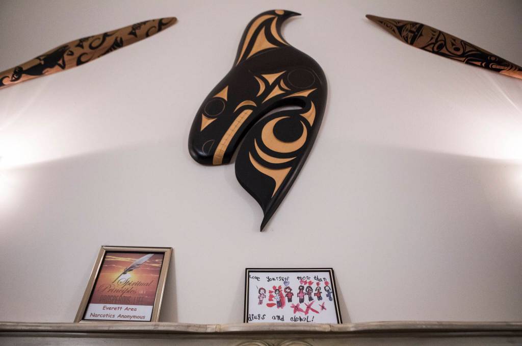 Art is displayed over the mantle in one of the gathering rooms at the Healing Lodge in Stanwood. (Olivia Vanni / The Herald)