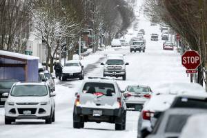Inches of snow cover roads Saturday afternoon in downtown Edmonds, Washington on February 13, 2021.  (Kevin Clark / The Herald)