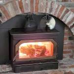 Caption: When the furnace broke in freezing weather, they were glad to have a wood burning stove and a newspaper subscription. (Jennifer Bardsley)
