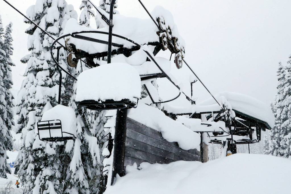 A chair lift sits idle on Stevens Pass on Dec. 30. (Kevin Clark / The Herald)