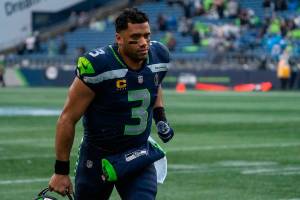 Seattle Seahawks quarterback Russell Wilson jogs off the field before an an NFL football game against the Detroit Lions, Sunday, Jan. 2, 2022, in Seattle. The Seahawks won 51-29. (AP Photo/Stephen Brashear)