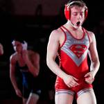 Stanwoods Tyler Rhue celebrates his victory over Arlingtons Chase Deberry in the 126-pound weight class at Stanwood High School on Thursday evening. The Spartans defeated the Eagles 50-21. (Kevin Clark / The Herald)
