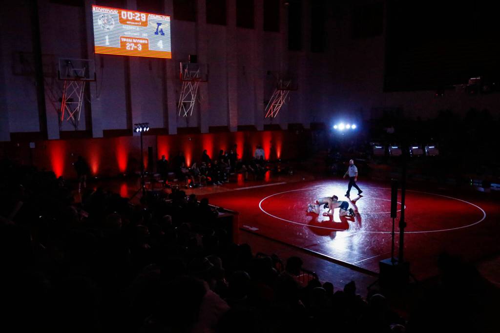 Stanwoods Cruise Swanson wrestles Arlingtons RJ Gese in the 160-pound weight class at Stanwood High School on Thursday evening. (Kevin Clark / The Herald)