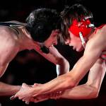 Arlington's David Forslof, left, faces on with Stanwood's Lane Ovenell in the 132lb weight class at Stanwood High School Thursday evening in Stanwood, Washington on January 6, 2022. The Spartans defeated the Eagles 50-21.  (Kevin Clark / The Herald)