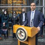 U.S. Attorney Nick Brown speaks on the steps of Federal Court on Tuesday in Seattle, along with leadership from the FBI and Seattle Police Department, about the Atomwaffen hate campaign following the sentencing of Kaleb Cole. (Steve Ringman/The Seattle Times via AP)